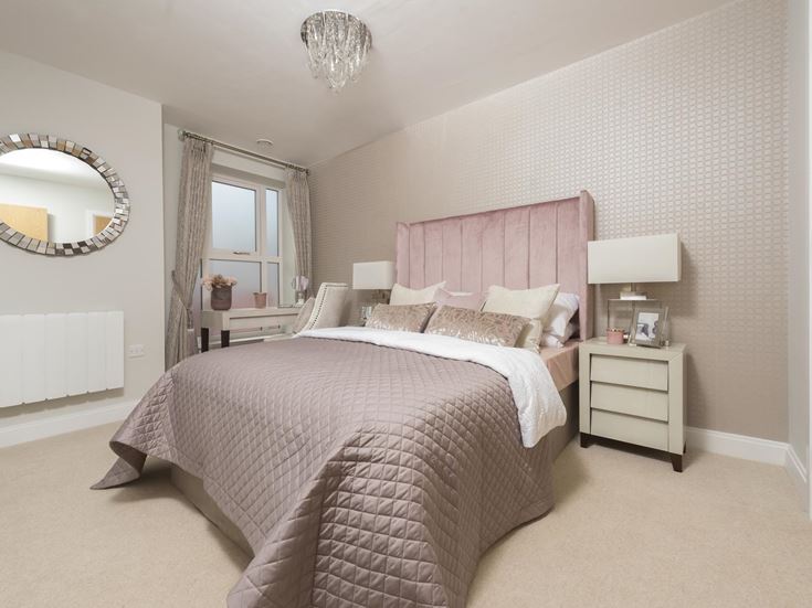 a bedroom with a large mirror