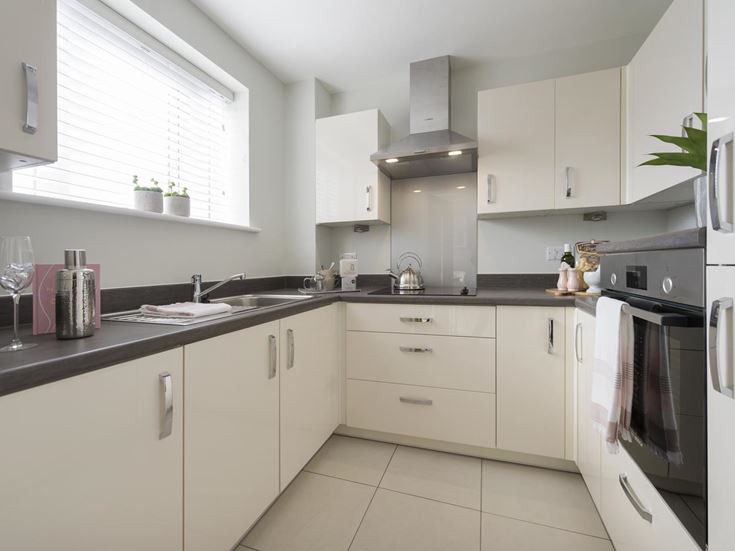 a kitchen with white cabinets