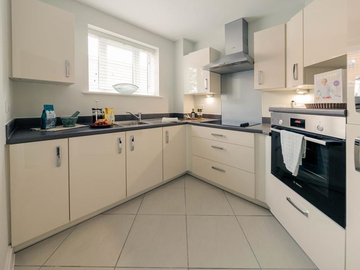 a kitchen with white cabinets