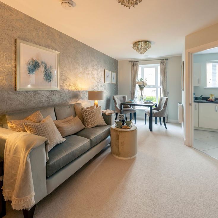 a large bedroom with a bed and a table