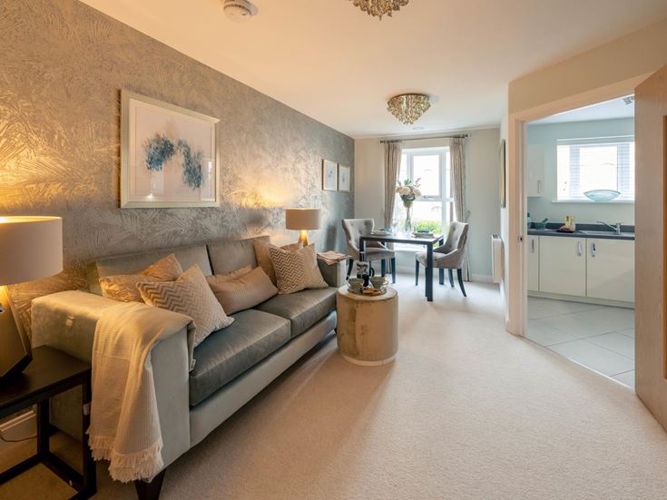 a large bedroom with a bed and a table
