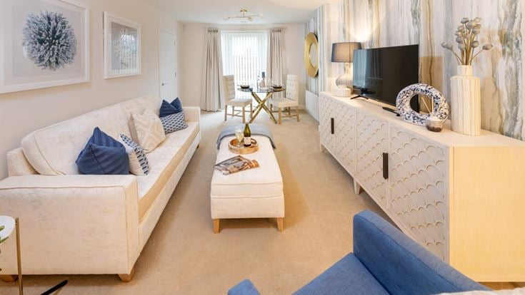 a living room with a couch and a tv