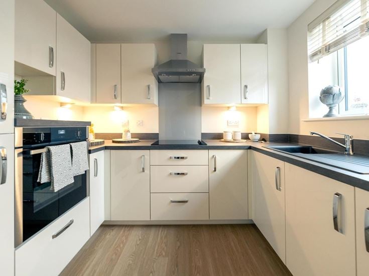 a kitchen with white cabinets