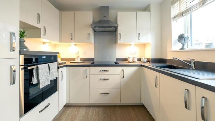 a kitchen with white cabinets
