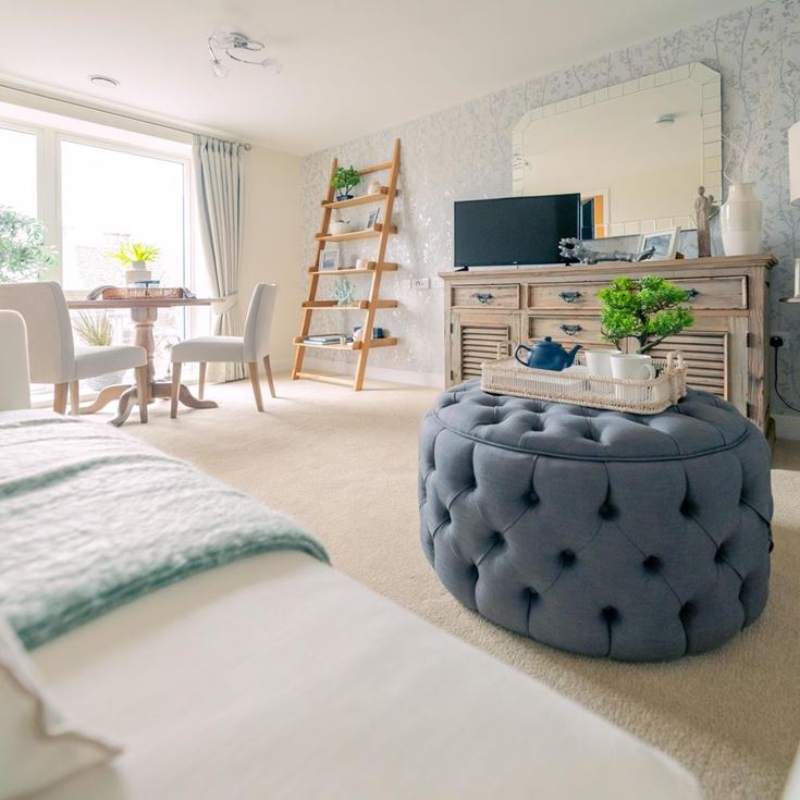 a bedroom with a bed and a fireplace