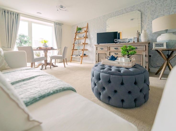 a bedroom with a bed and a fireplace