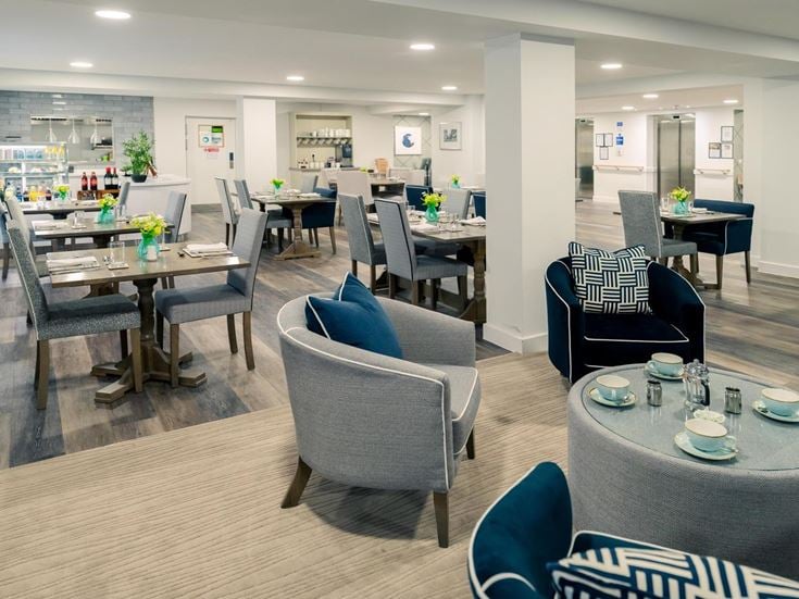 a large room with tables and chairs