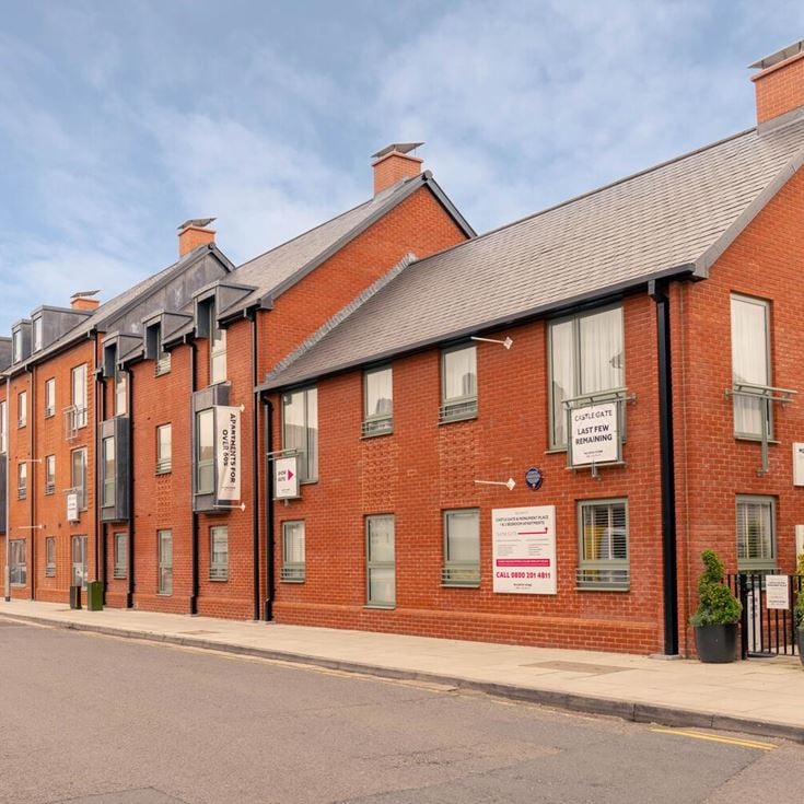 a brick building with a sign on the front