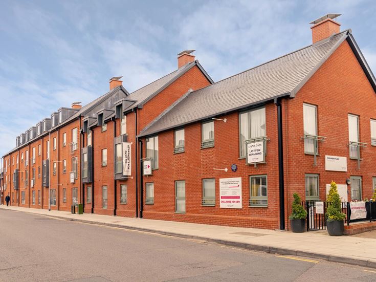 a brick building with a sign on the front