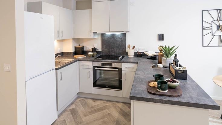 a kitchen with white cabinets