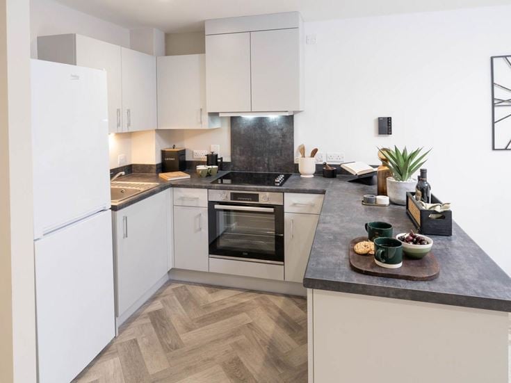 a kitchen with white cabinets