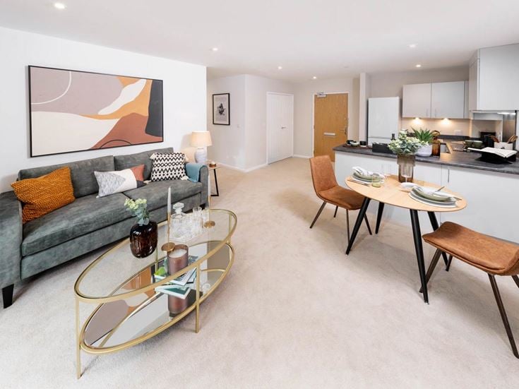 a living room with a couch and a table