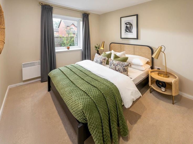 a bedroom with a bed and a table