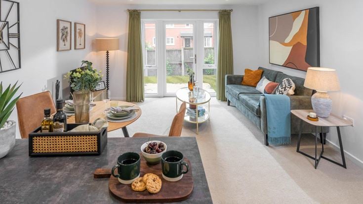 a living room with a couch and coffee table