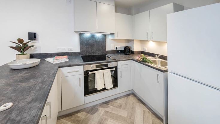 a kitchen with white cabinets