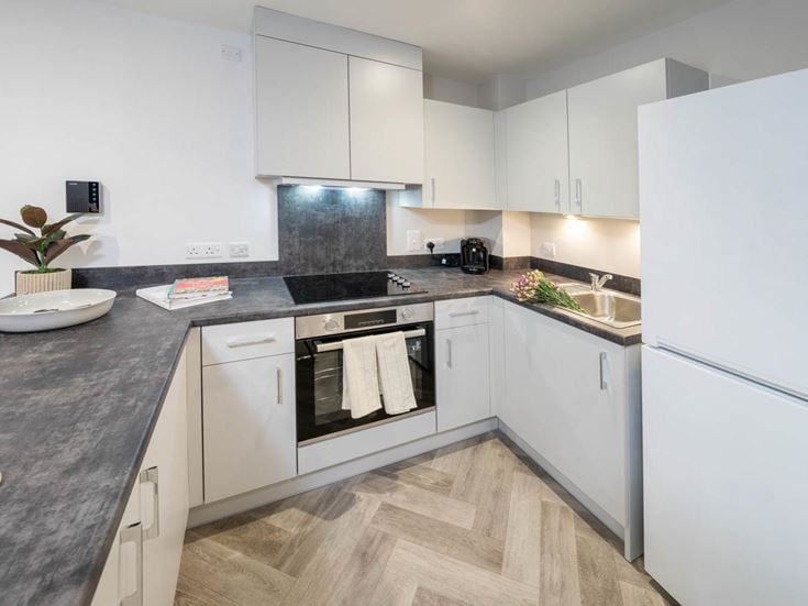 a kitchen with white cabinets