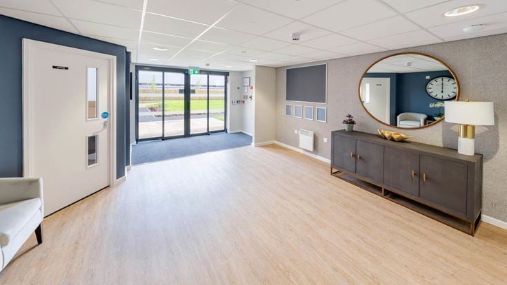a large room with a large mirror