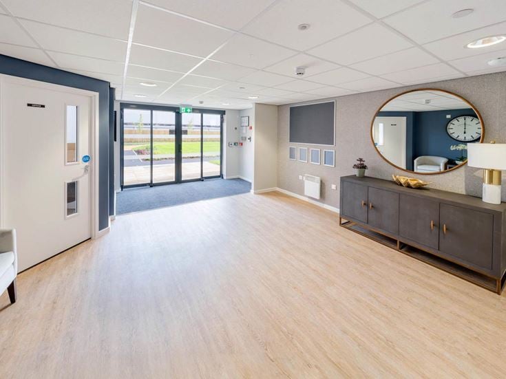 a large room with a large mirror