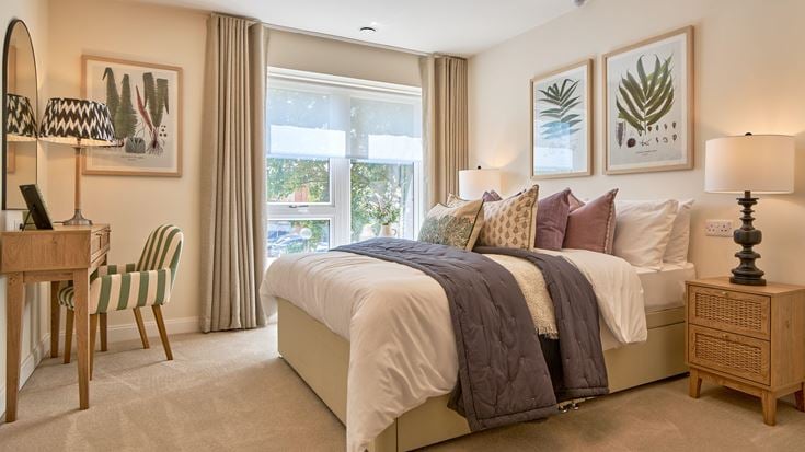a bedroom with a bed and a chair
