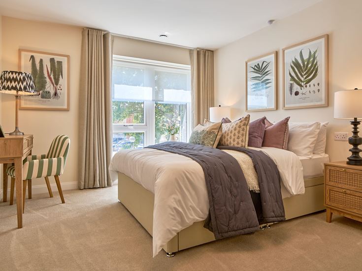 a bedroom with a bed and a chair