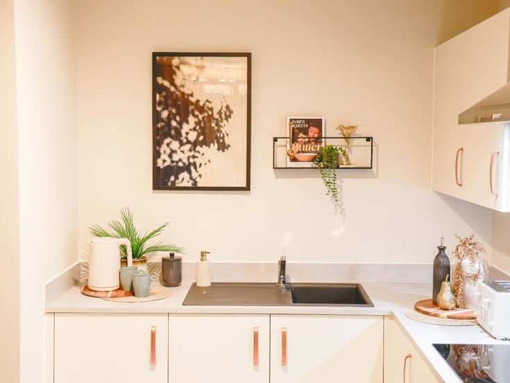 a kitchen with white cabinets