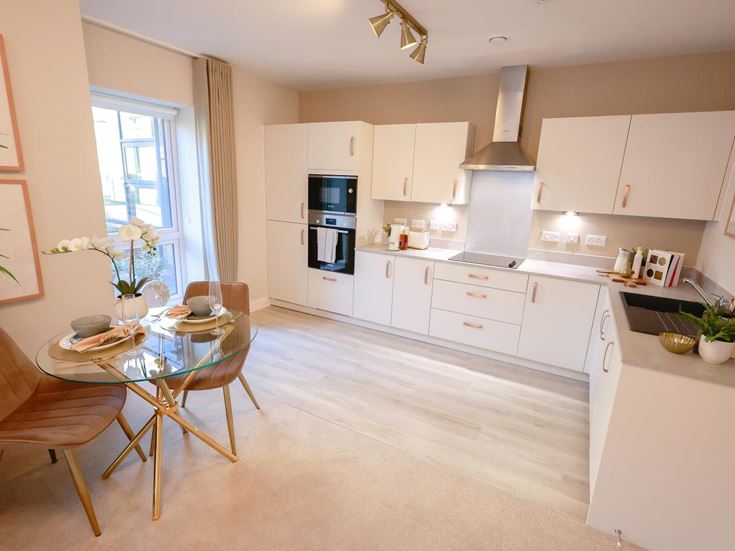 a kitchen with white cabinets