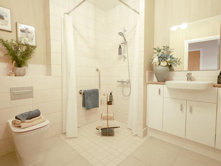 a bathroom with a shower and toilet