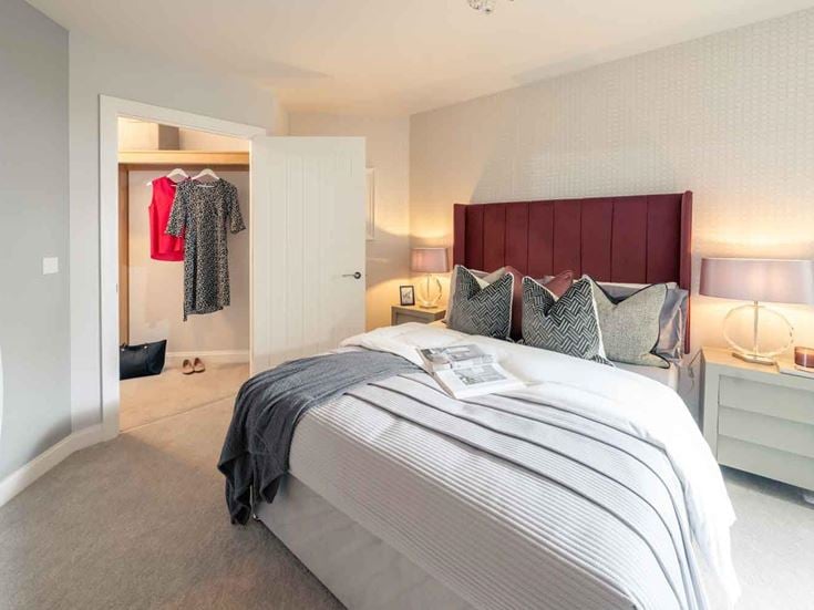a bedroom with a bed and a closet