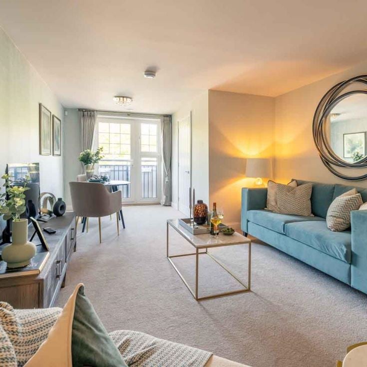 a living room with a blue couch