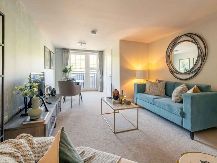 a living room with a blue couch