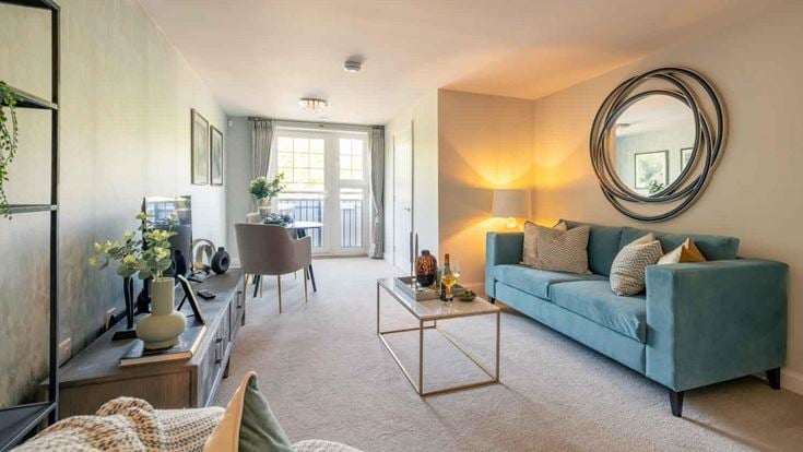 a living room with a blue couch