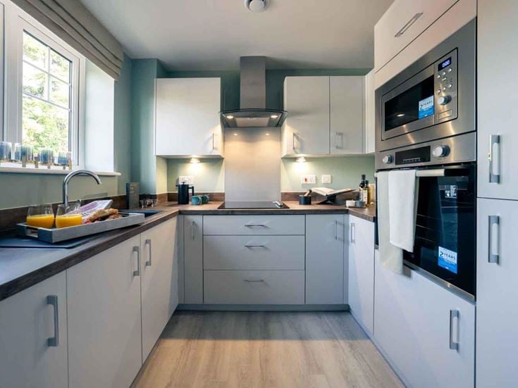 a kitchen with white cabinets