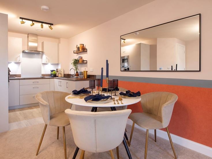 a kitchen with a table and chairs