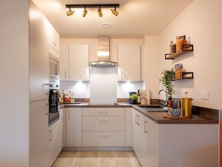 a kitchen with white cabinets