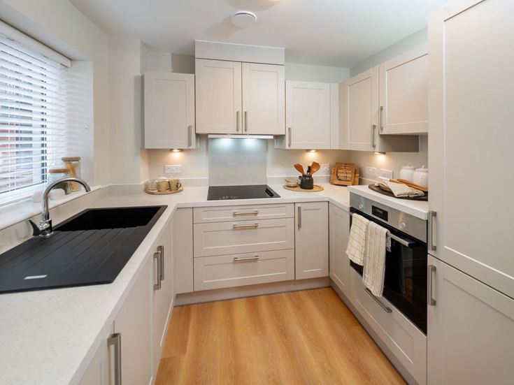 a kitchen with white cabinets