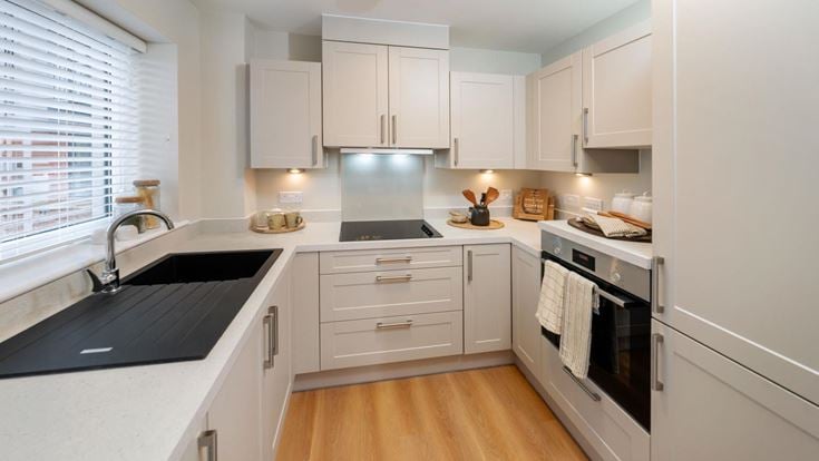 a kitchen with white cabinets