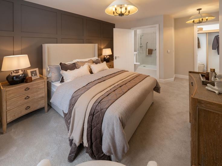 a bedroom with a bed and dresser
