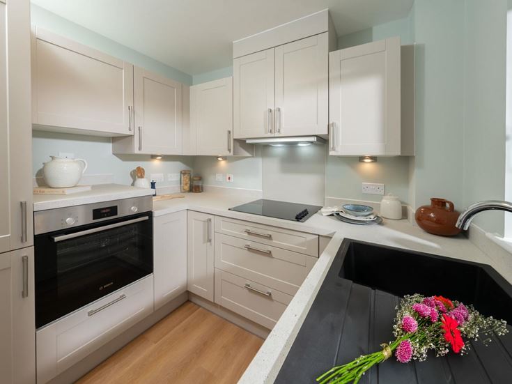 a kitchen with white cabinets