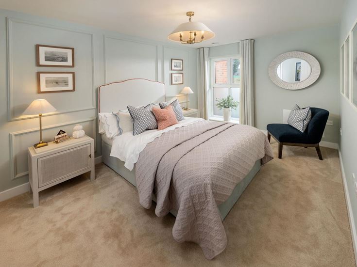 a bedroom with a bed and a chair