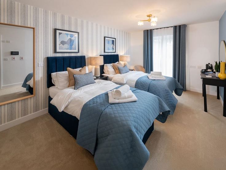 a bedroom with a bed and a mirror