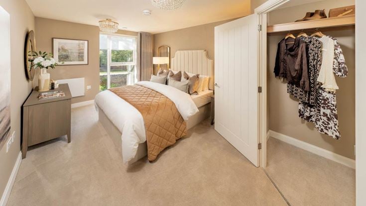 a bedroom with a bed and a closet