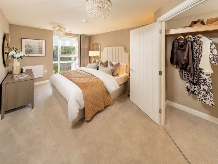 a bedroom with a bed and a closet