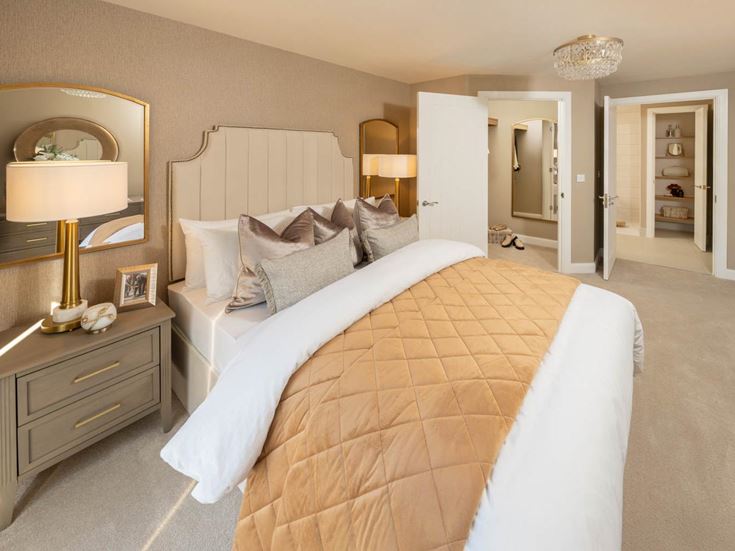 a bedroom with a bed and lamps