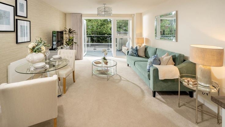a living room with a green couch