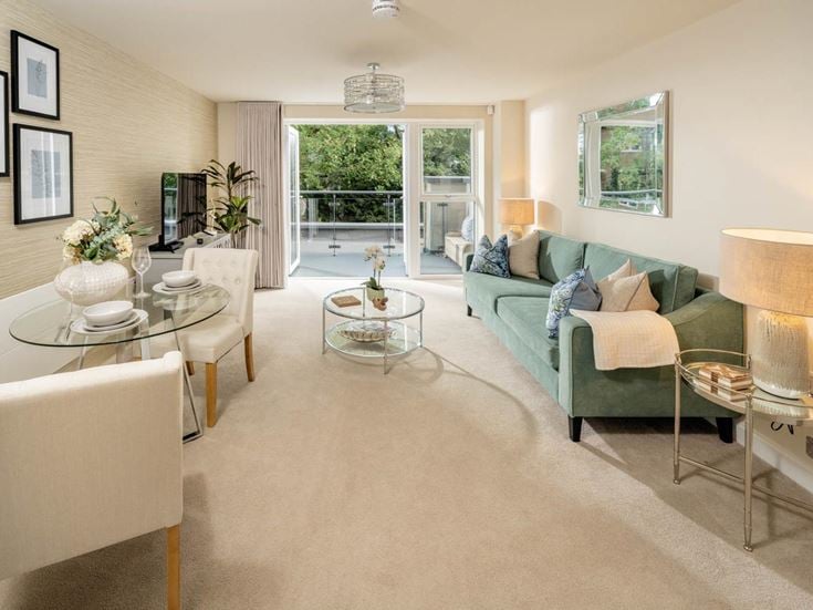 a living room with a green couch