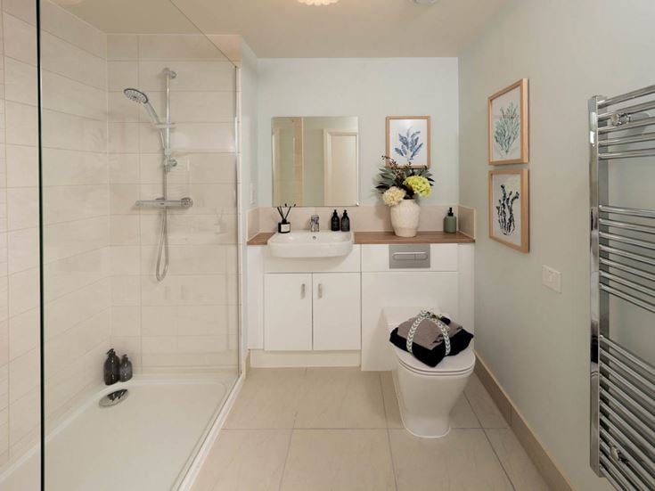 a bathroom with a tub sink and toilet