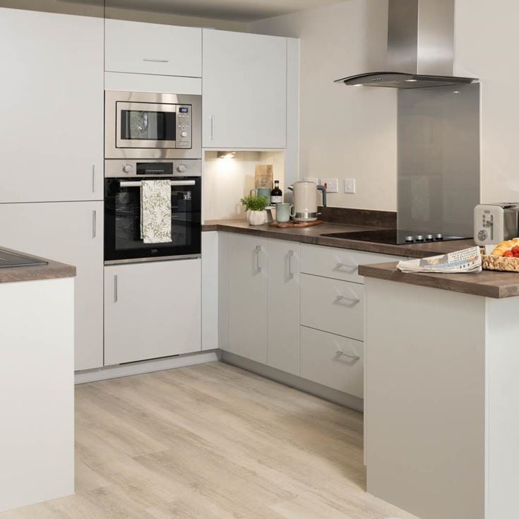 a kitchen with white cabinets