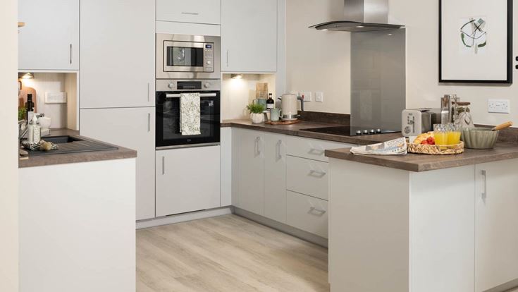 a kitchen with white cabinets