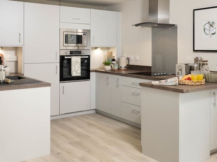 a kitchen with white cabinets