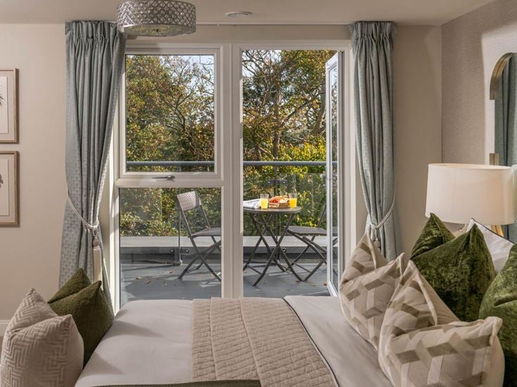 a bedroom with a large window